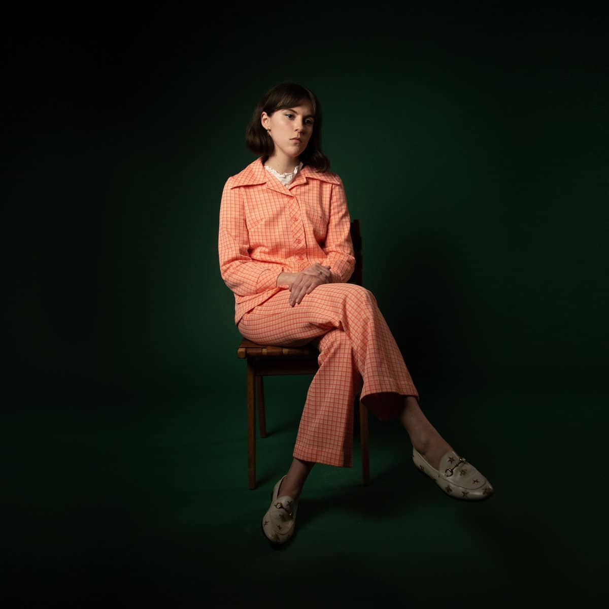 Alannah Kavanagh of Grizzly Coast sitting on a stool with her legs crossed