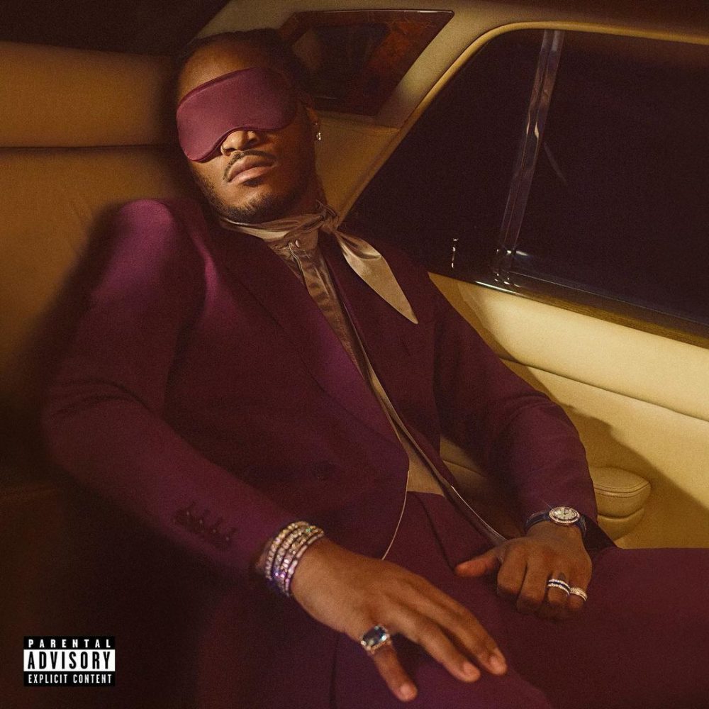 Artist Future sleeping in the backseat of a car with blindfolds over his eyes